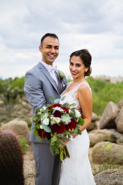 Bride and groom pose during their Troon North wedding by Arizona wedding photographer PMA Photography.
