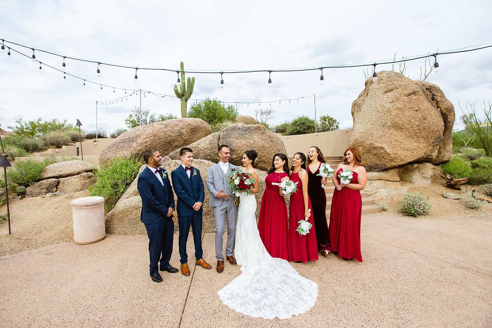 Bridal party laughing together at Troon North wedding by Scottsdale wedding photographer PMA Photography.