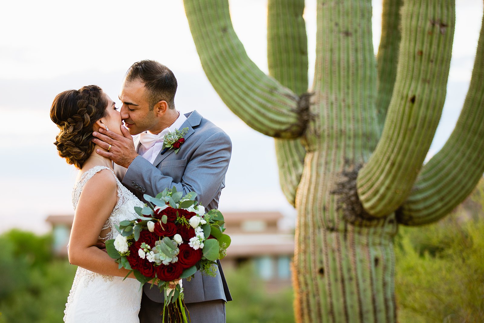 Bride and groom share an intimate moment during their Troon North wedding by Scottsdale wedding photographer PMA Photography.