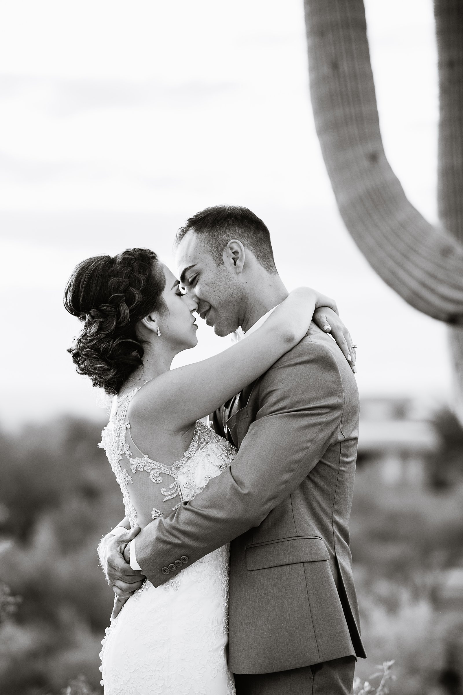 Bride and groom share an intimate moment at their Troon North wedding by Arizona wedding photographer PMA Photography.
