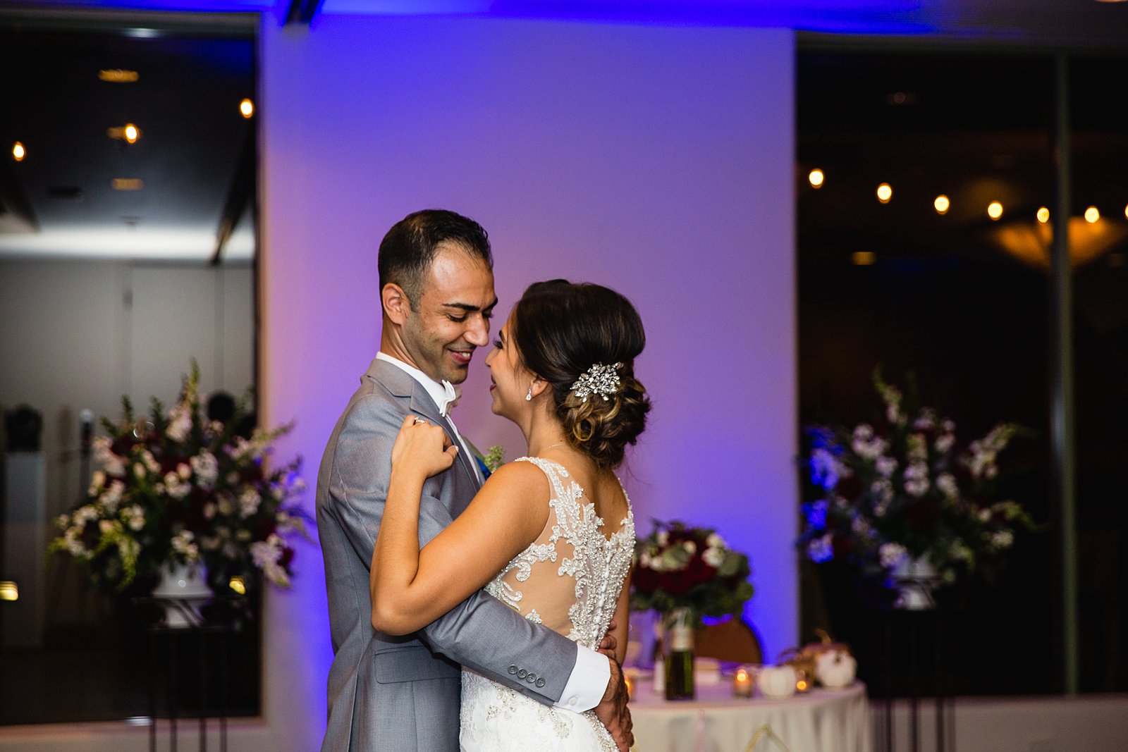 Bride and groom sharing first dance at their Troon North wedding reception by Arizona wedding photographer PMA Photography.