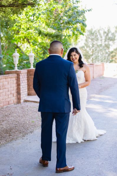 Bride and groom's first look at The Farmhouse at Schnepf Farms by Arizona wedding photographer PMA Photography.