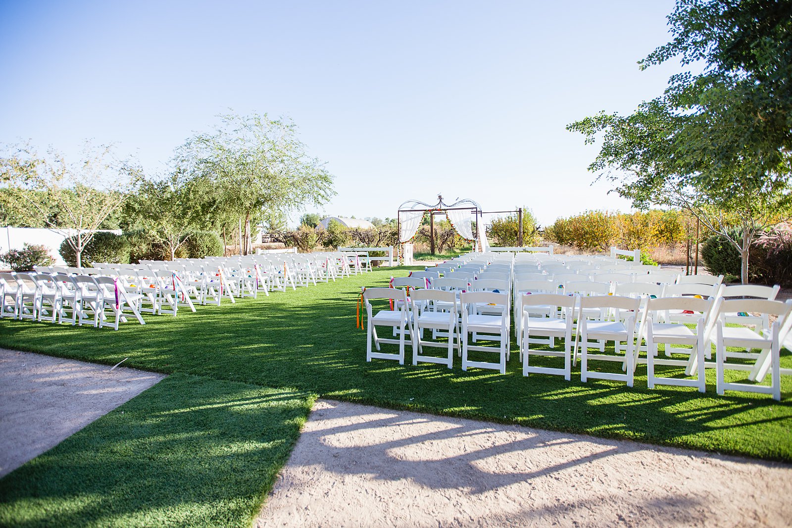 Wedding ceremony at The Farmhouse at Schnepf Farms by Arizona wedding photographer PMA Photography.