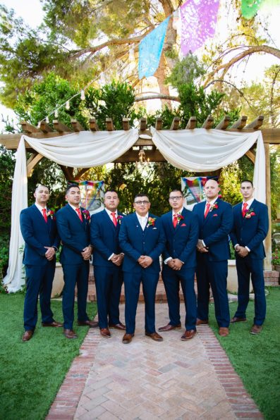 Groom and groomsmen together at a The Farmhouse at Schnepf Farms wedding by Arizona wedding photographer PMA Photography.