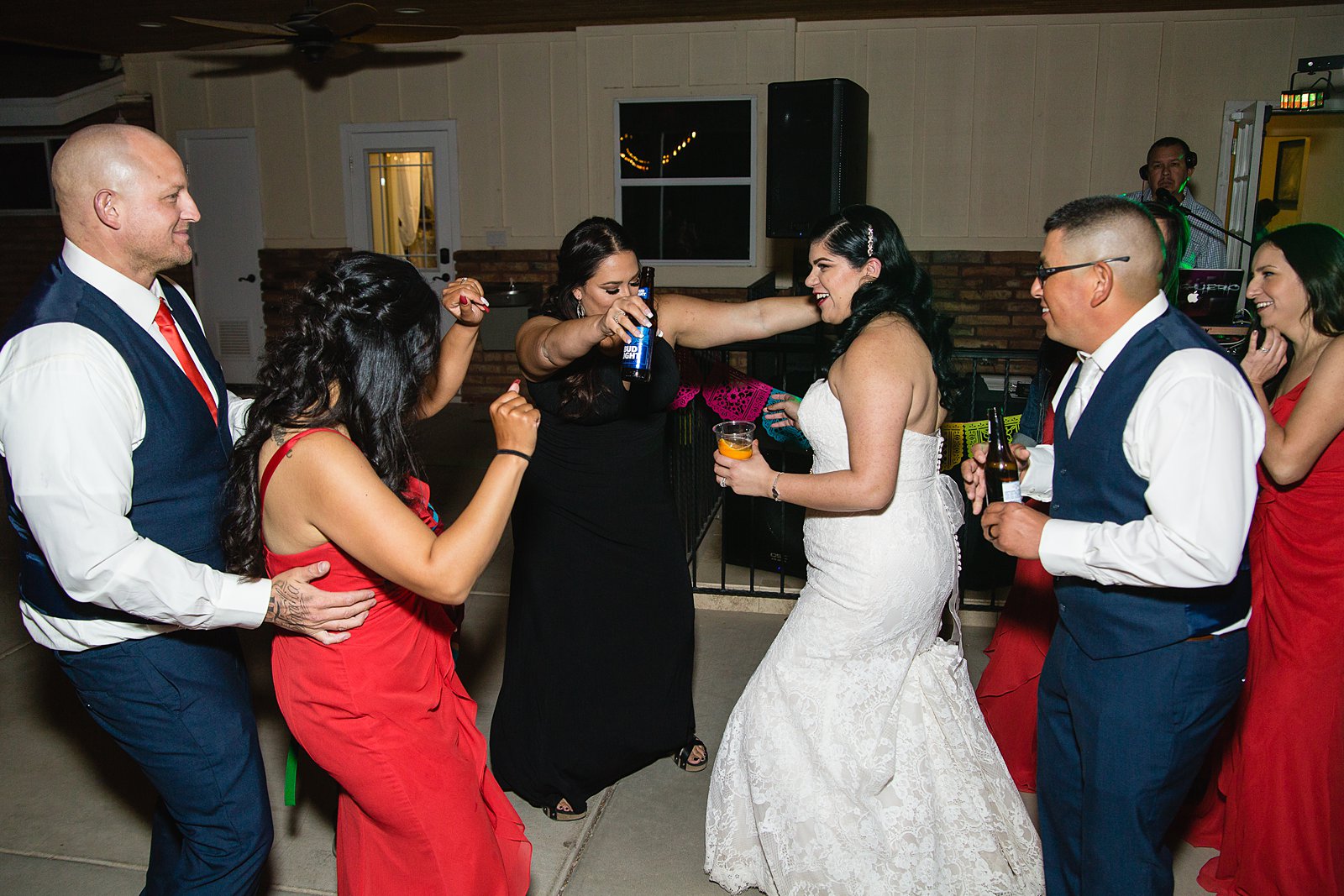 Bride and groom dancing with guests at their The Farmhouse at Schnepf Farms wedding reception by Arizona wedding photographer PMA Photography