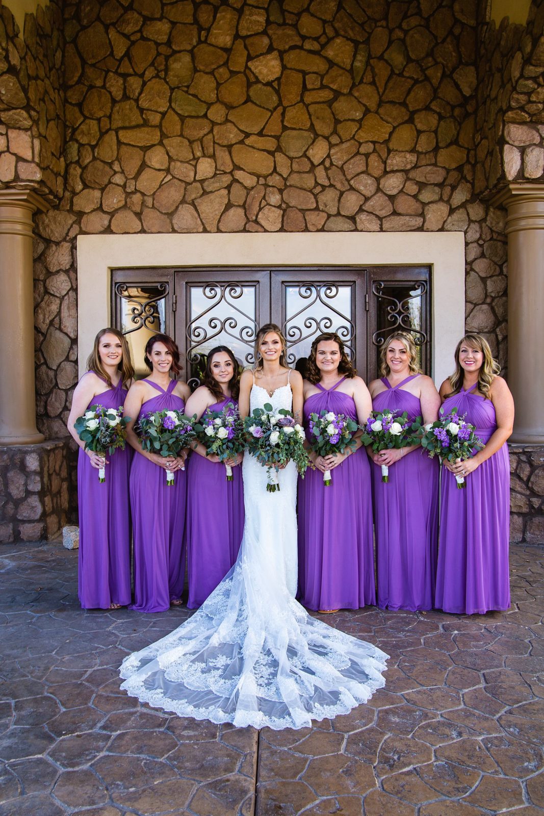 Bride and bridesmaids together at a Superstition Manor wedding by Arizona wedding photographer PMA Photography.