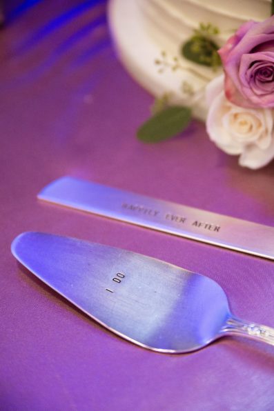 Cake serving knife stamped with "I Do" and "Happily Ever After" by PMA Photography.