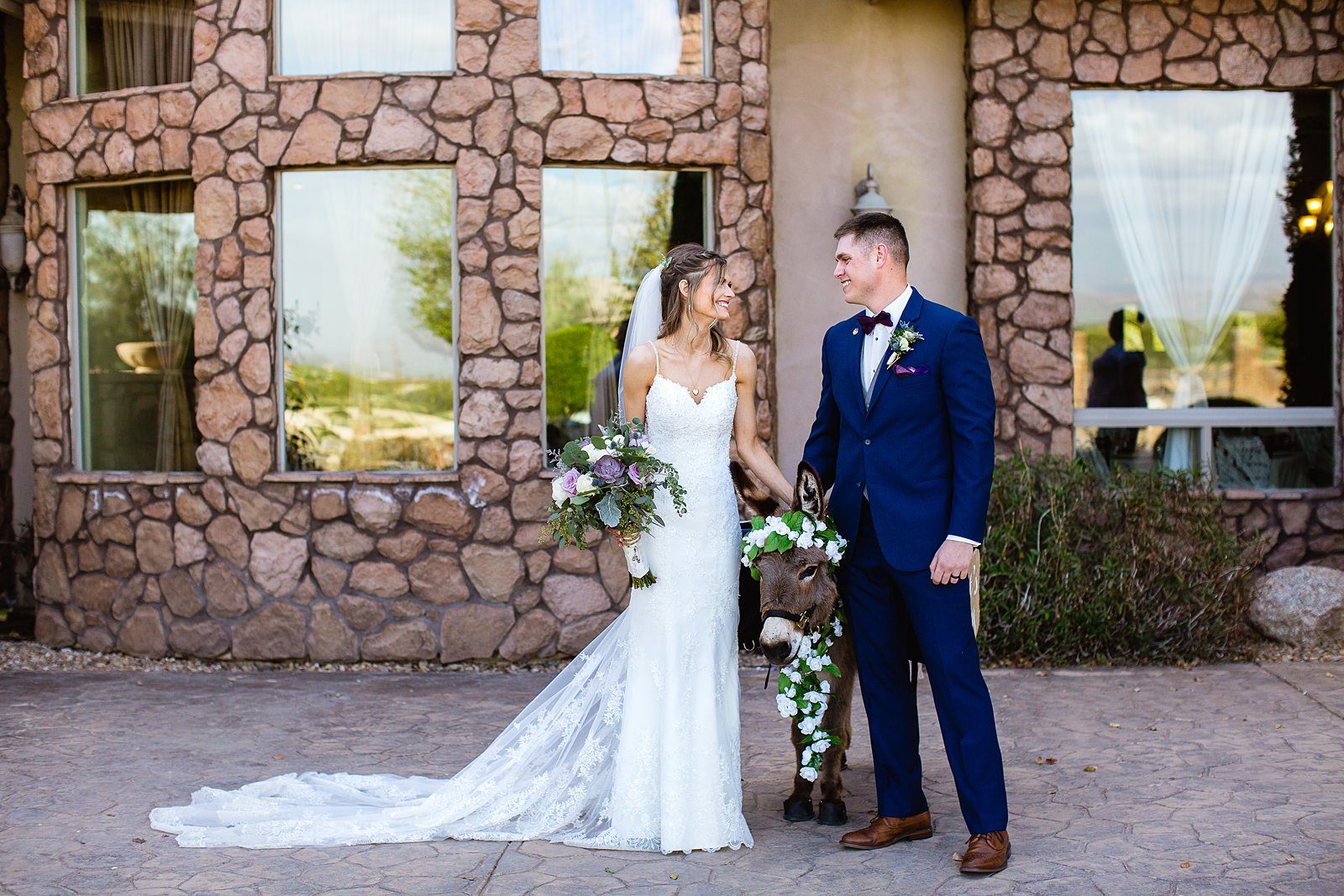 Bride and groom with the beer burro at their Superstition Manor wedding by Mesa wedding photographer PMA Photography.