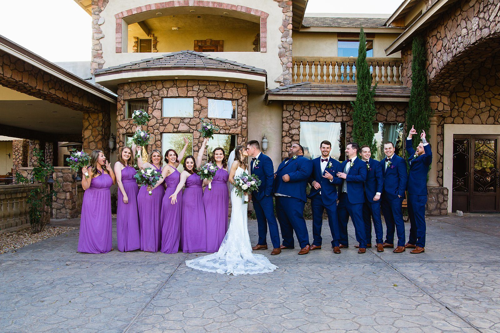 Bridal party having fun together at Superstition Manor weding by Arizona wedding photographer PMA Photography.