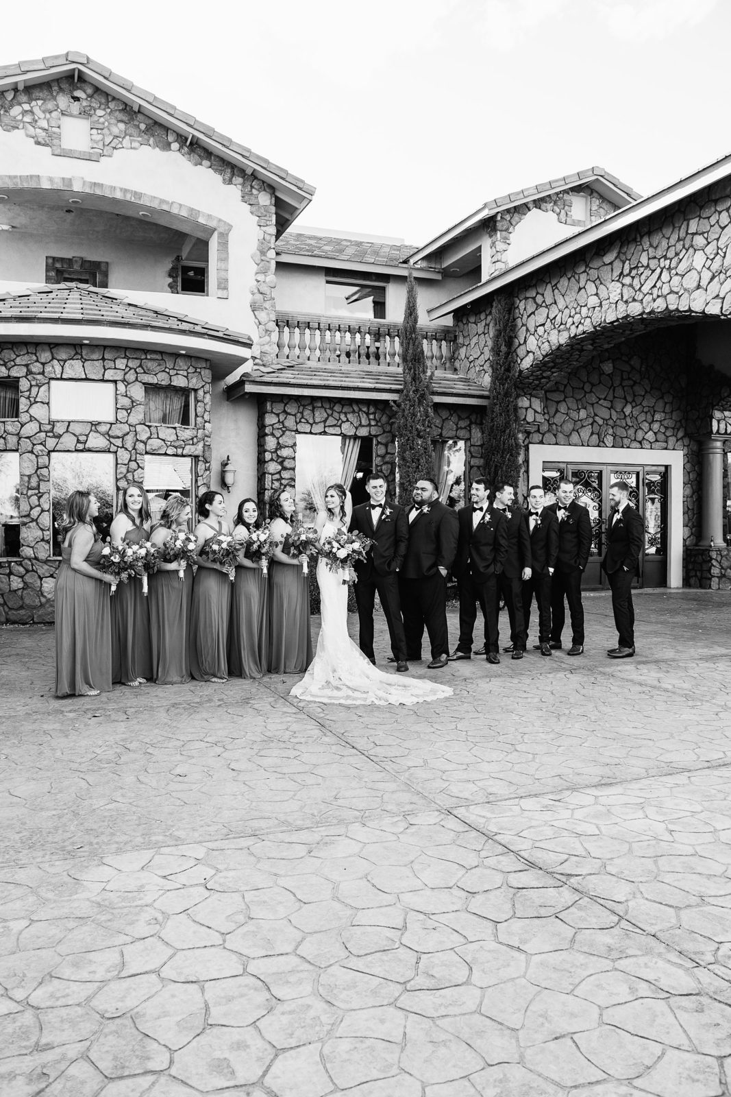 Bridal party laughing together at Superstition Manor wedding by Mesa wedding photographer PMA Photography.