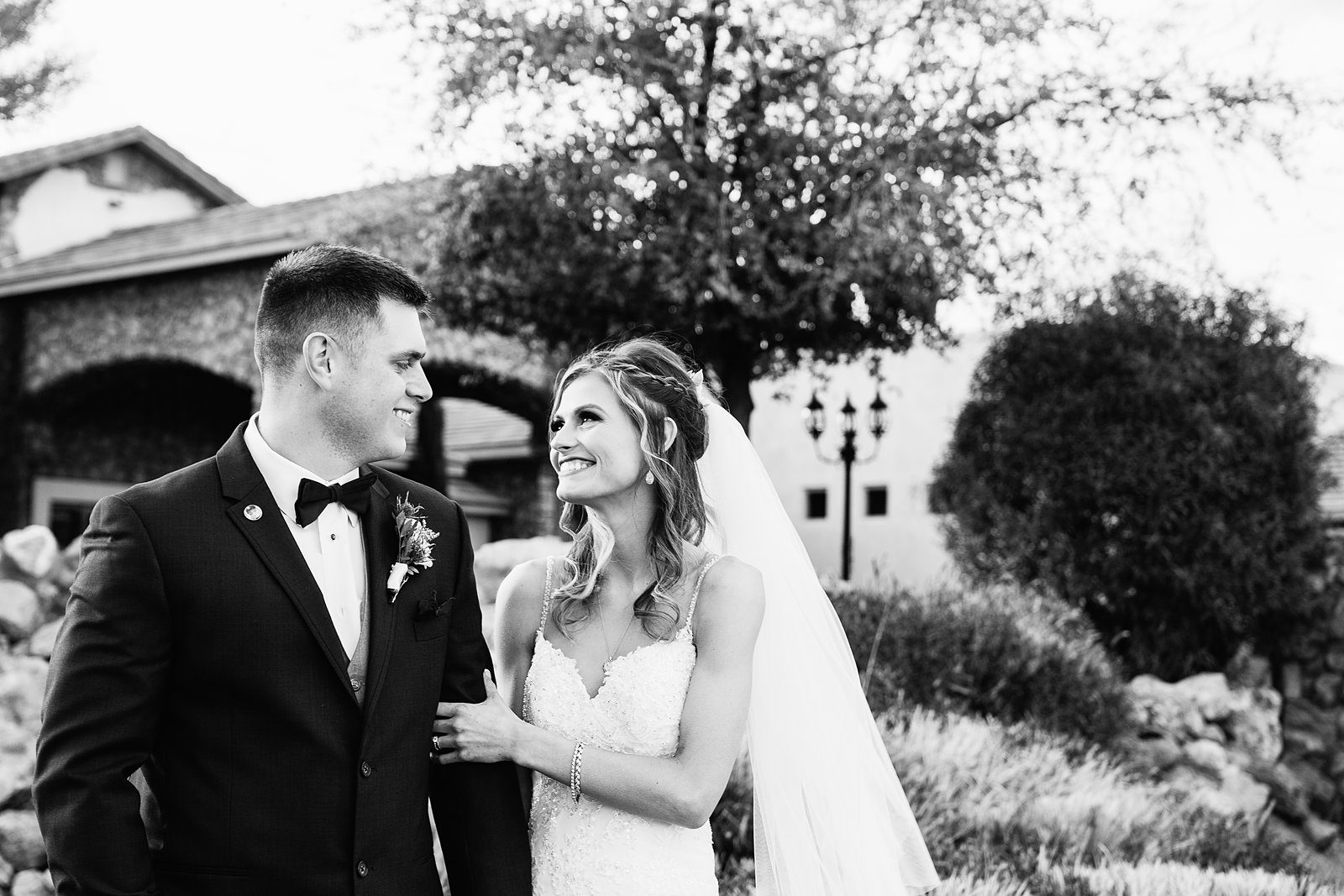 Bride and Groom laughing together during their Superstition Manor wedding by Mesa wedding photographer PMA Photography.