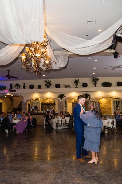 Mother son dance at a Superstition Manor wedding reception by Arizona wedding photographer PMA Photography.