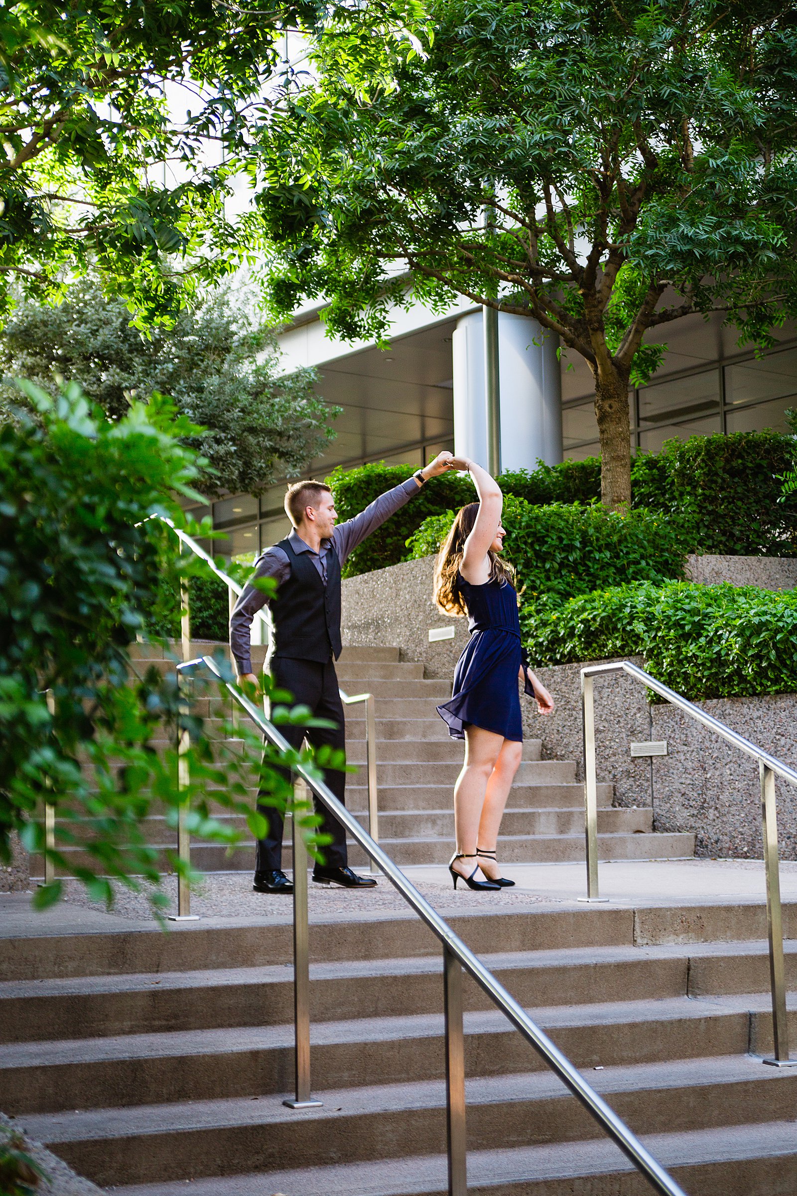 Couple pose for their Downtown Phoenix engagement session by Phoenix wedding photographer PMA Photography.