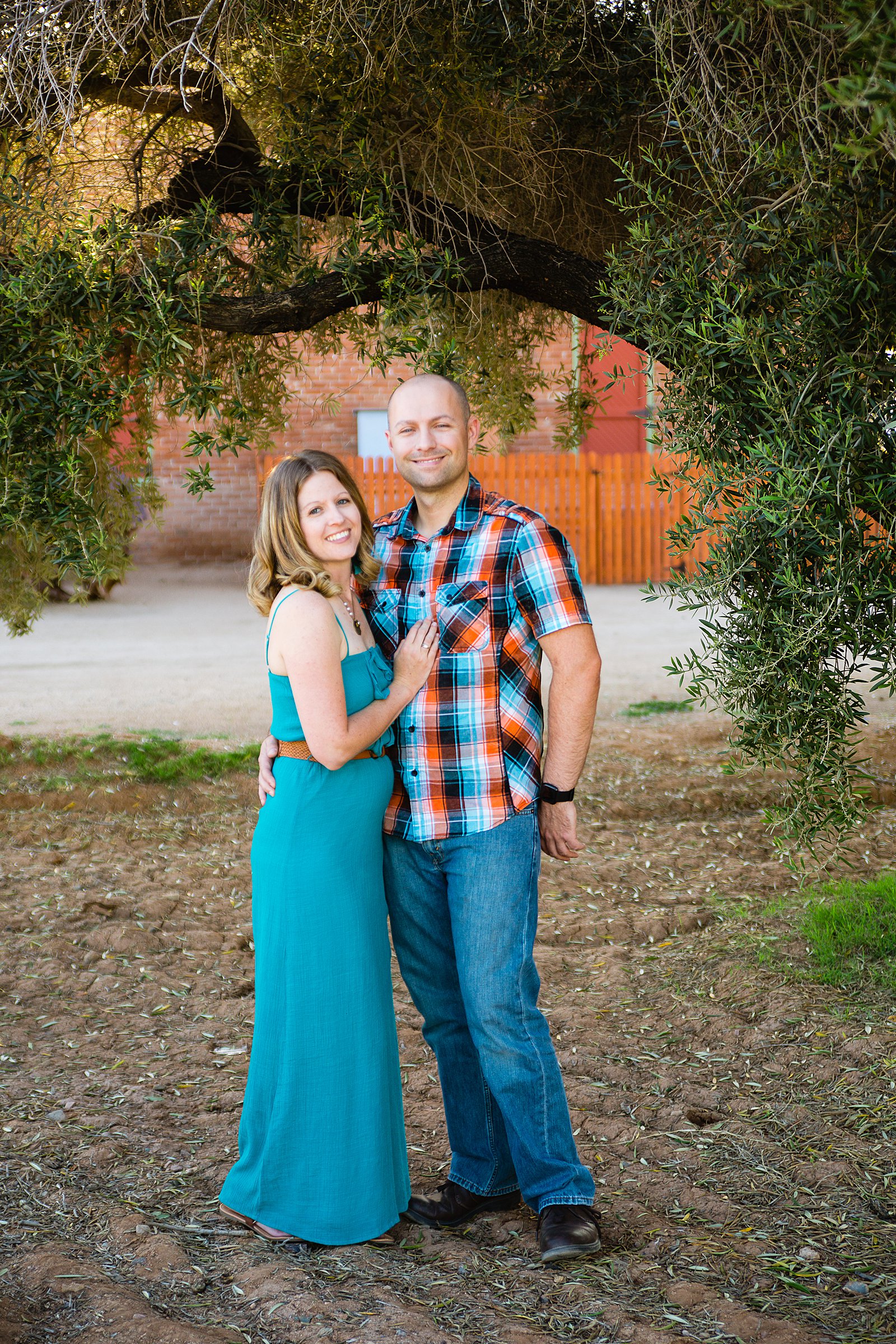 Couple pose for their Sahuaro Ranch engagement session by Phoenix wedding photographer PMA Photography.