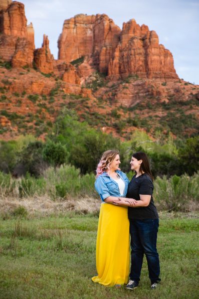 Same Sex couple pose for their Crescent Moon Ranch engagement session by Sedona wedding photographer PMA Photography.