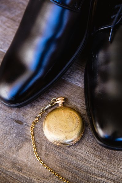 Groom's wedding day details of his father's pocket watch by PMA Photography.