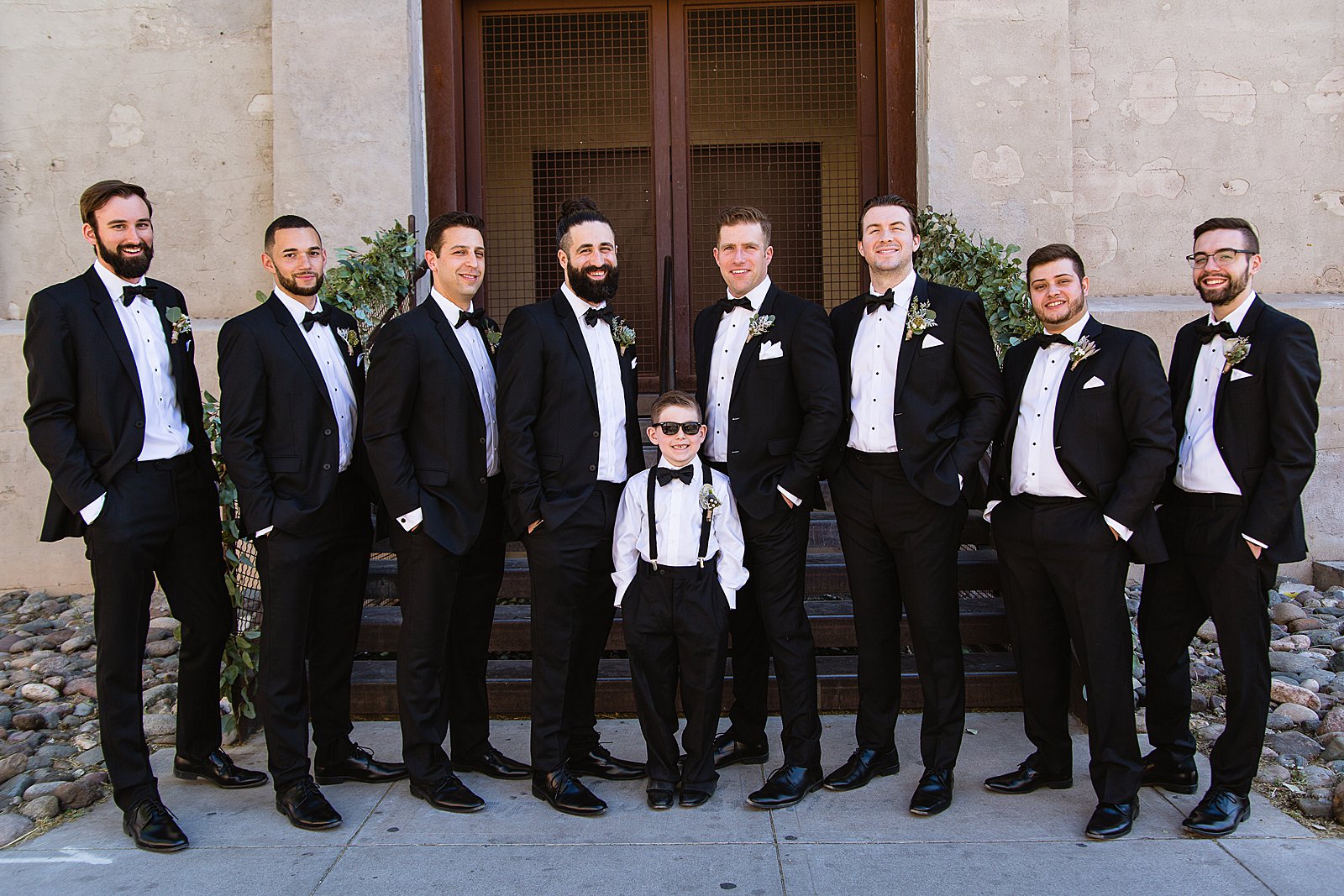 Groom and groomsmen together at a The Ice House wedding by Arizona wedding photographer PMA Photography.