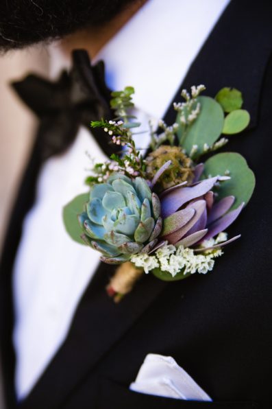 Groom's green and purple succulent boutonniere by PMA Photography.
