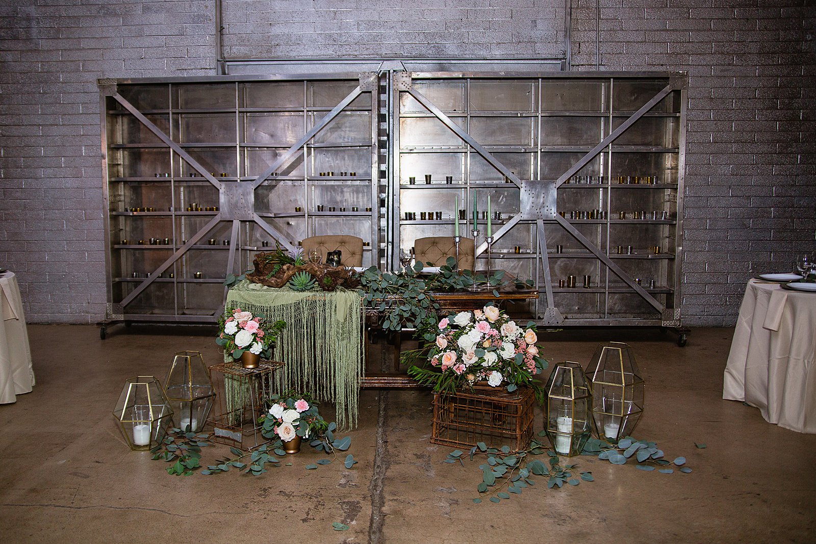 Romantic, bohemian sweetheart table at The Ice House wedding reception by Arizona wedding photographer PMA Photography.