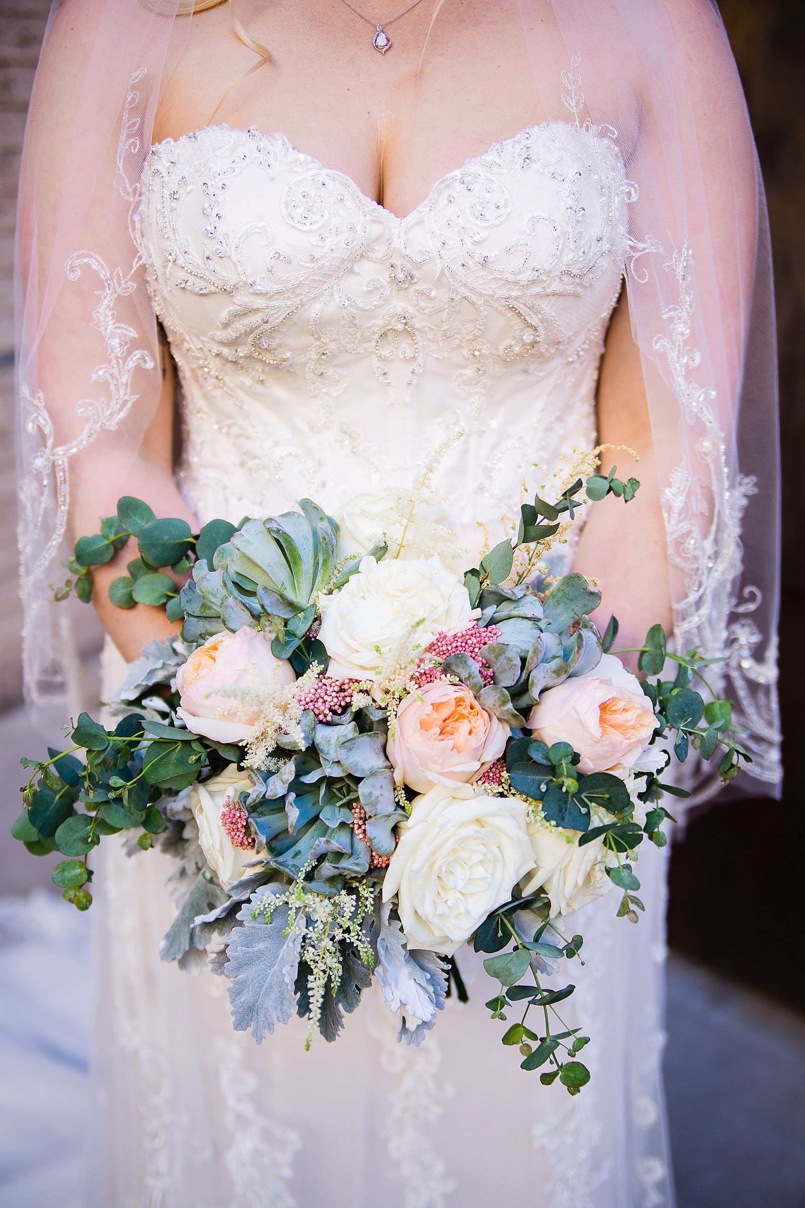 Romantic cream and pink succulent bouquet by PMA Photography.