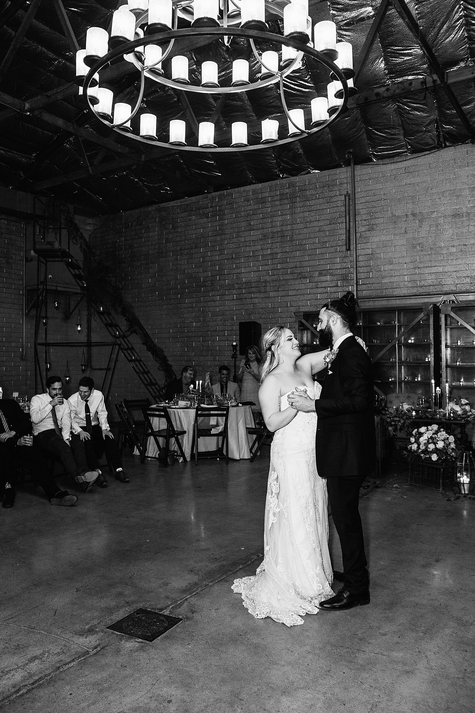 Bride and Groom sharing first dance at their The Ice House wedding reception by Arizona wedding photographer PMA Photography.