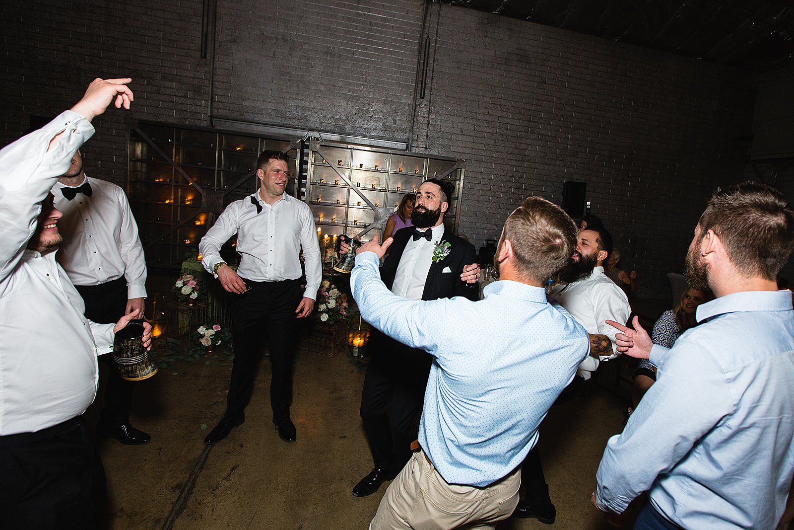 Groom dancing with guests at The Ice House wedding reception by Phoenix wedding photographer PMA Photography