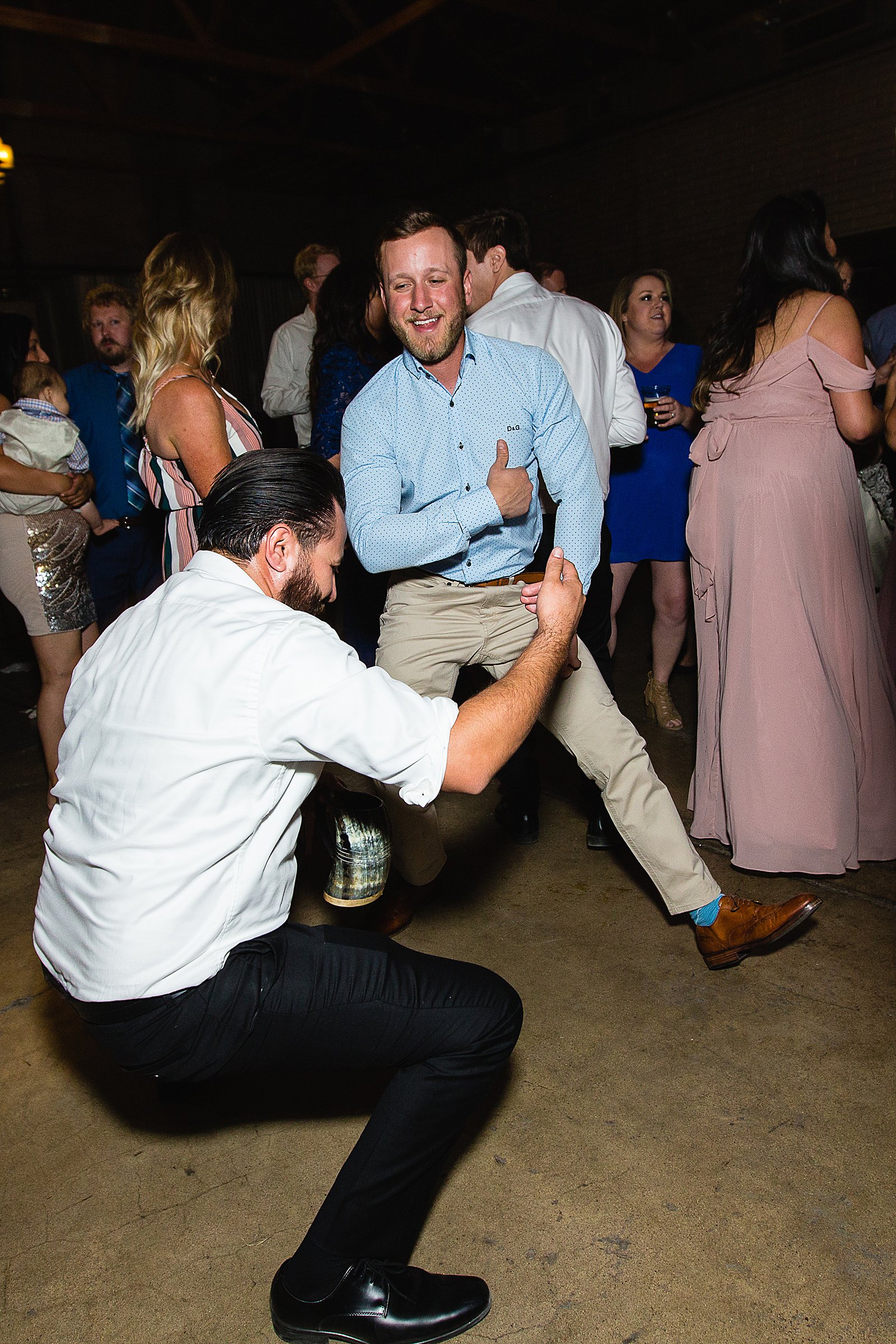 Guests dancing at their The Ice House wedding reception by Arizona wedding photographer PMA Photography