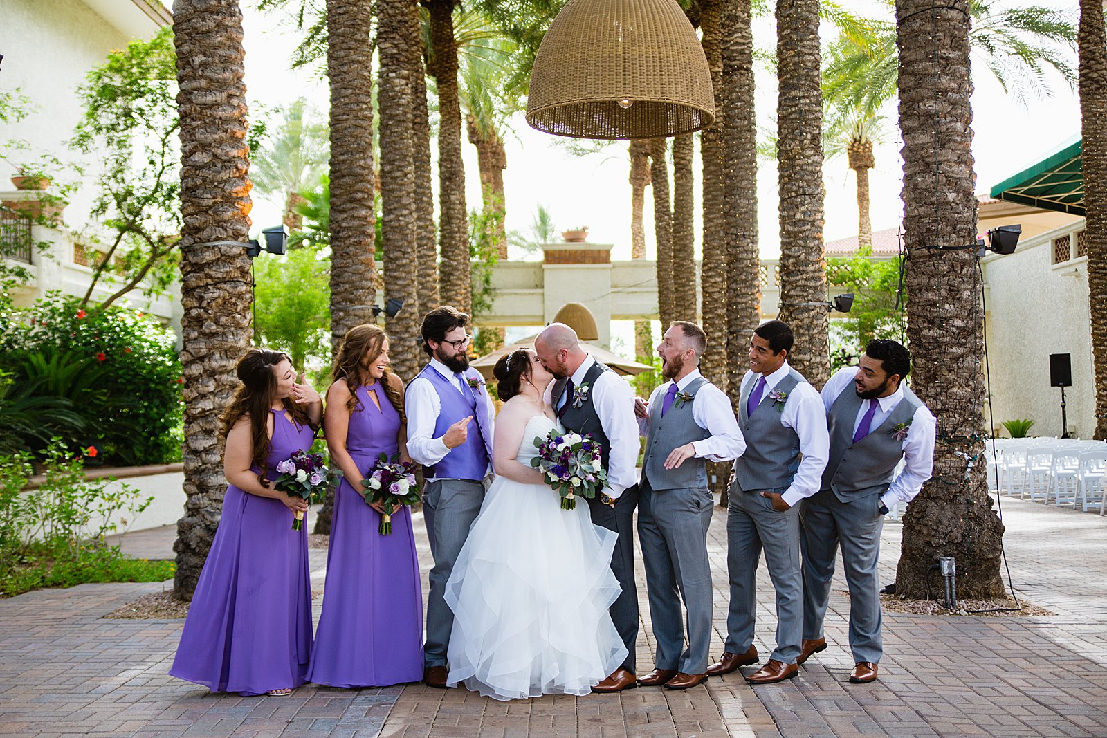 Bridal party having fun together at Arizona Grand Resort weding by Arizona wedding photographer PMA Photography.