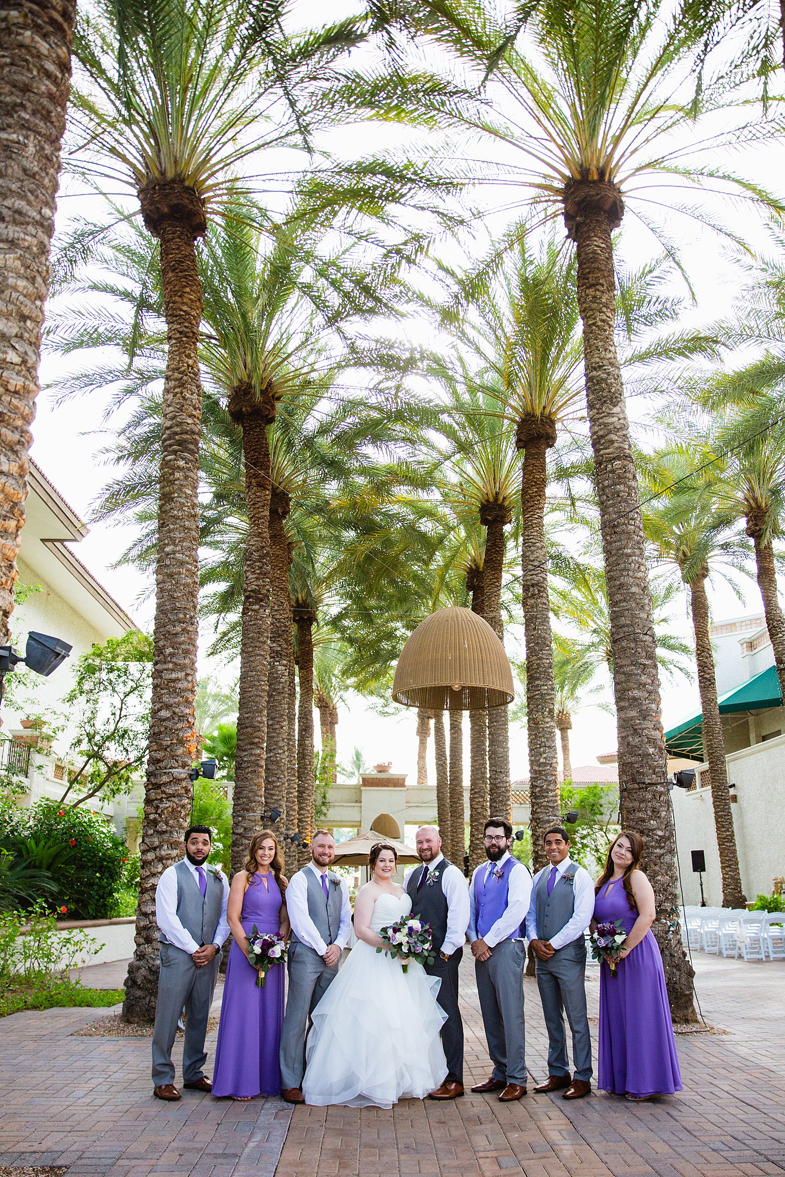 Bridal party together at a Arizona Grand Resort wedding by Arizona wedding photographer PMA Photography.