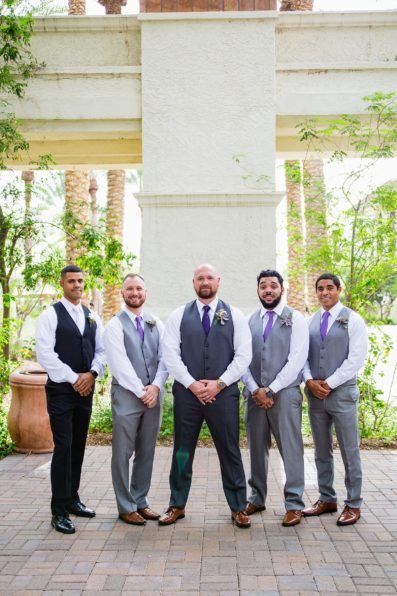 Groom and groomsmen together at a Arizona Grand Resort wedding by Arizona wedding photographer PMA Photography.