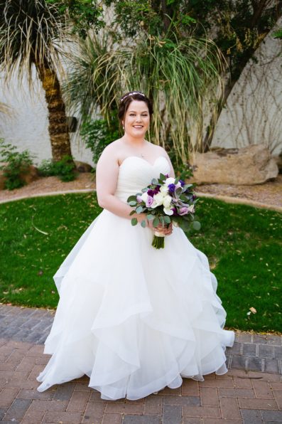 Bride's classic wedding dress with purple and green succulent bouquet for her Arizona Grand Resort wedding by PMA Photography.