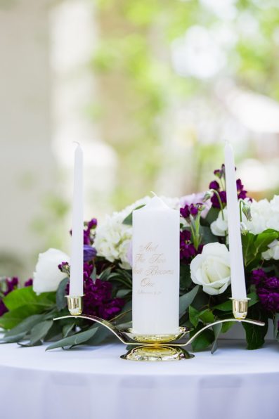 White candle for a unity ceremony by PMA Photography.