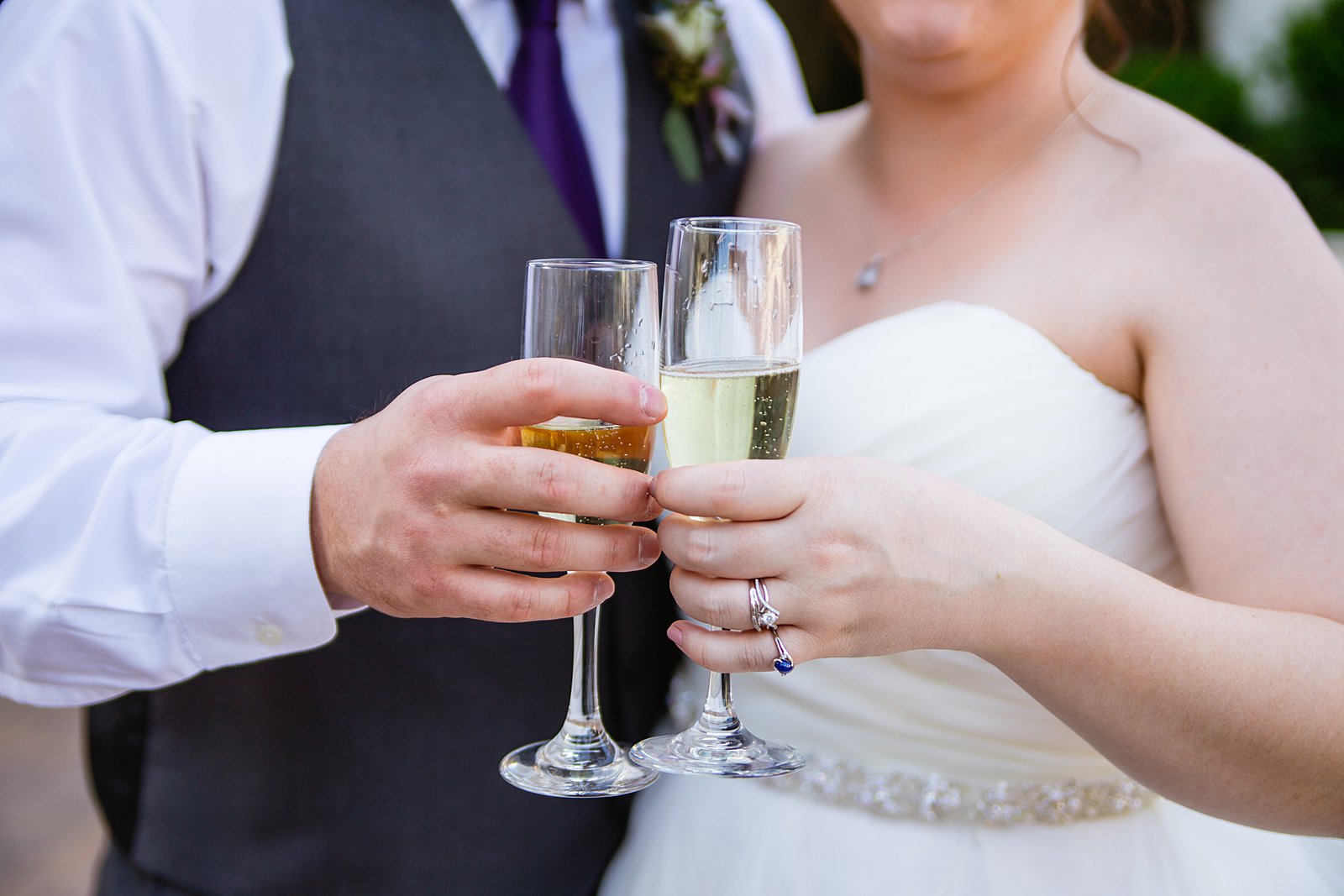 Bride and groom share a champagne toast after the wedding ceremony by PMA Photography.