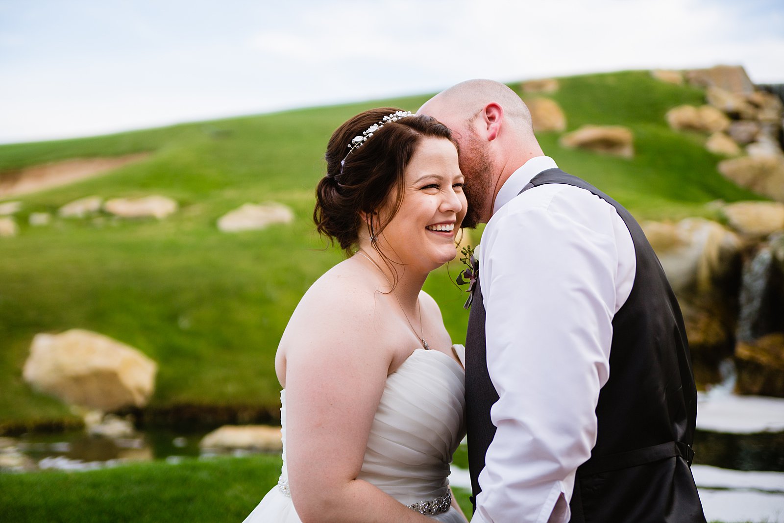 Bride and Groom laughing together during their Arizona Grand Resort wedding by Phoenix wedding photographer PMA Photography.