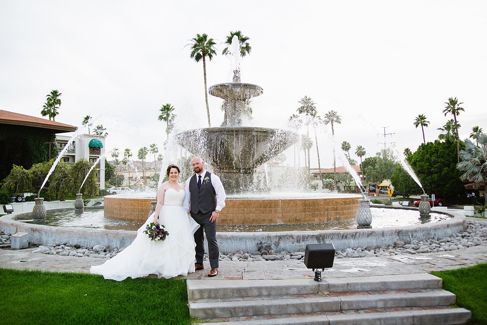 Bride and Groom pose for their Arizona Grand Resort wedding by Phoenix wedding photographer PMA Photography.