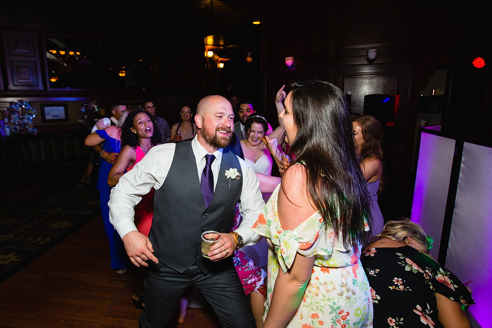Groom dancing with guests at Arizona Grand Resort wedding reception by Phoenix wedding photographer PMA Photography