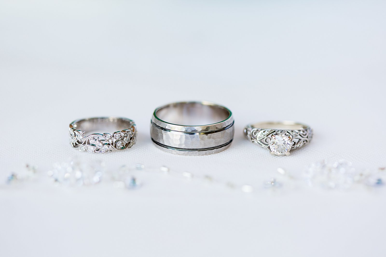 White gold and diamond floral inspired wedding bands by PMA Photography.