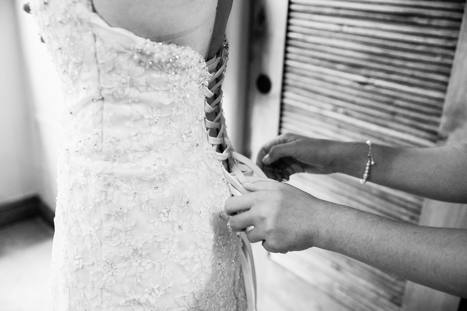 Bride getting ready for her wedding by Arizona wedding photographers PMA Photographer