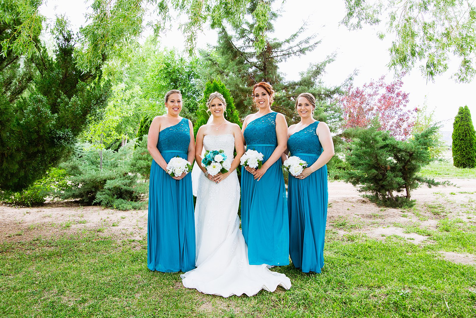Bride and bridesmaids together at a The Windmill House wedding by Arizona wedding photographer PMA Photography.