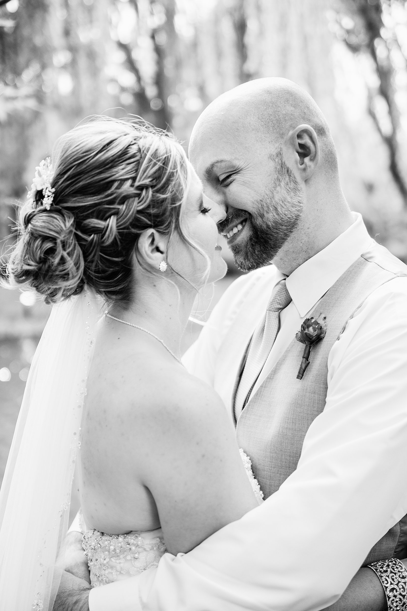 Bride and Groom share a kiss during their The Windmill House wedding by Chino Valley wedding photographer PMA Photography.