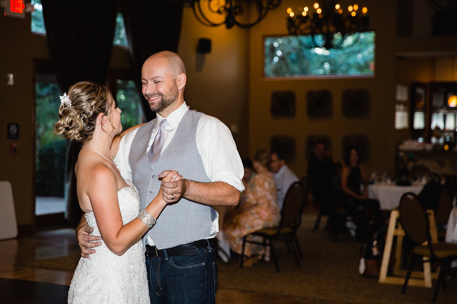 Bride and Groom sharing first dance at their The Windmill House wedding reception by Arizona wedding photographer PMA Photography.