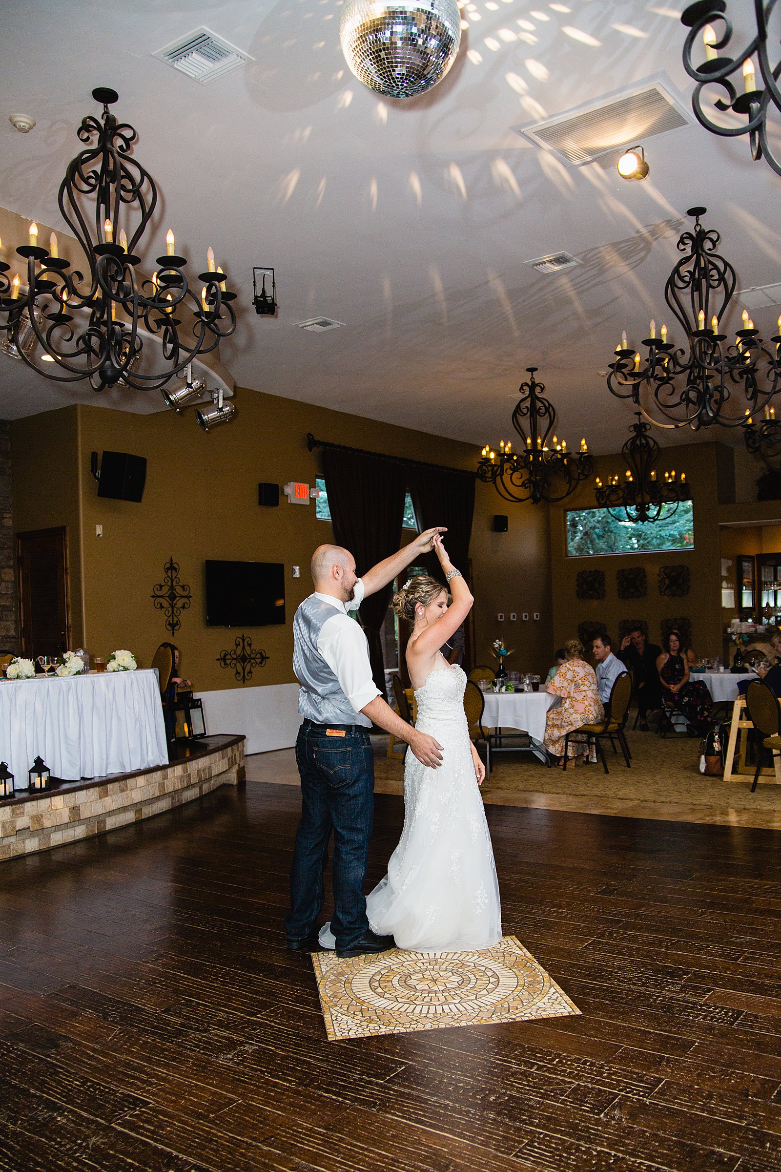 Bride and Groom sharing first dance at their The Windmill House wedding reception by Arizona wedding photographer PMA Photography.