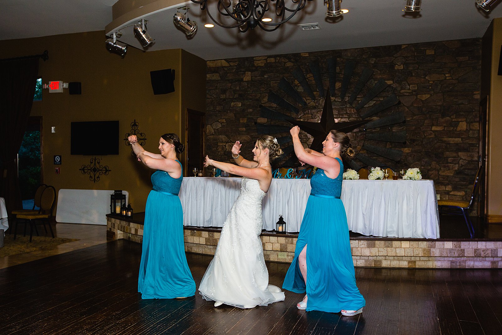 Bride dancing with guests at The Windmill House wedding reception by Chino Valley wedding photographer PMA Photography