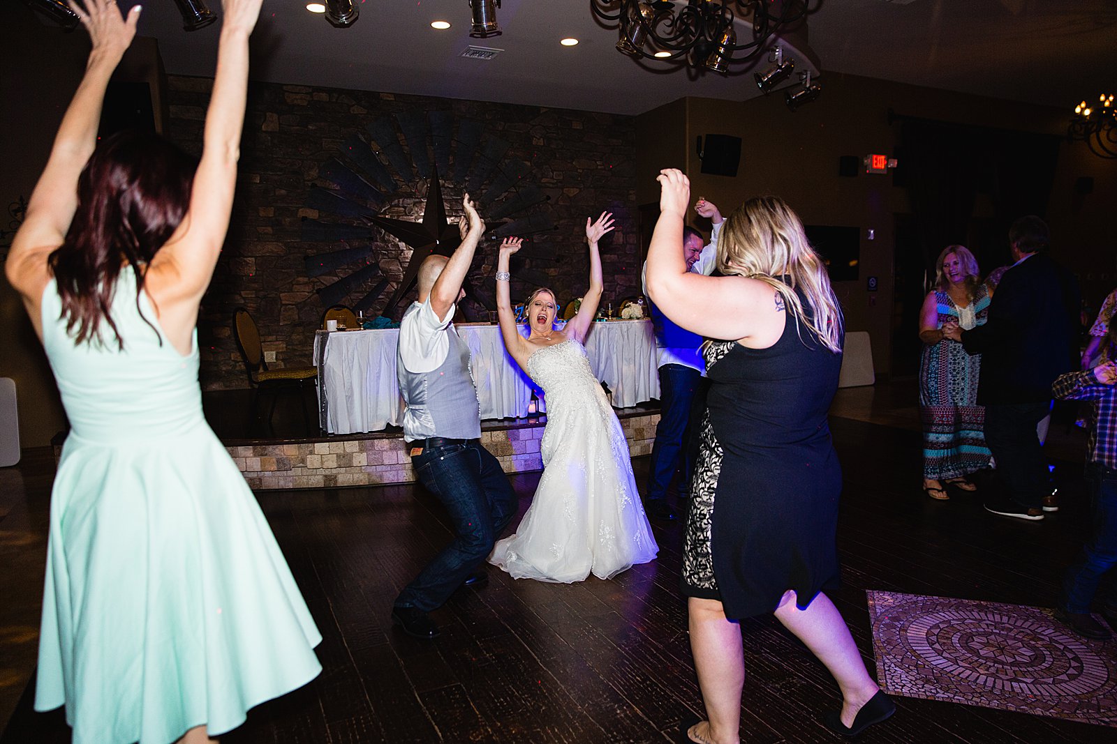 Bride and Groom dancing with guests at their The Windmill House wedding reception by Arizona wedding photographer PMA Photography