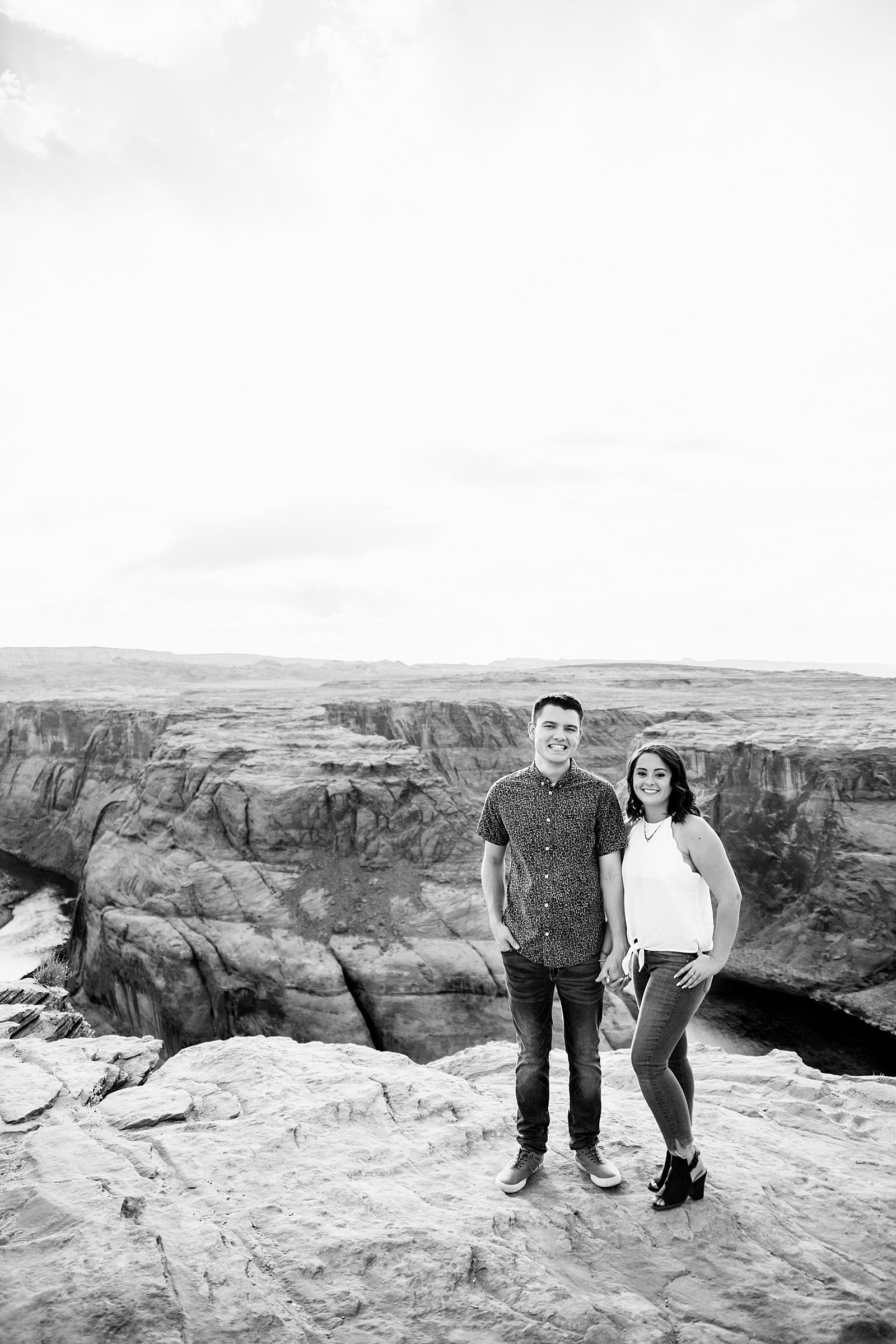 Couple pose for their Horshoe Bend engagement session by Page wedding photographer PMA Photography.