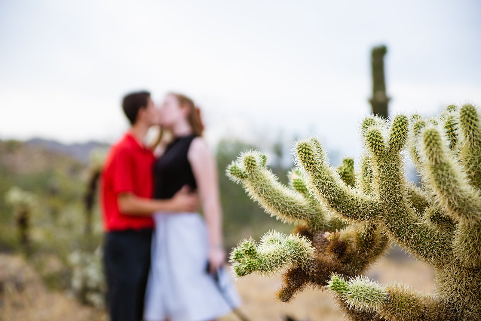 Couple share an intimate moment during their White Tanks anniversary session by Phoenix engagement photographer PMA Photography.