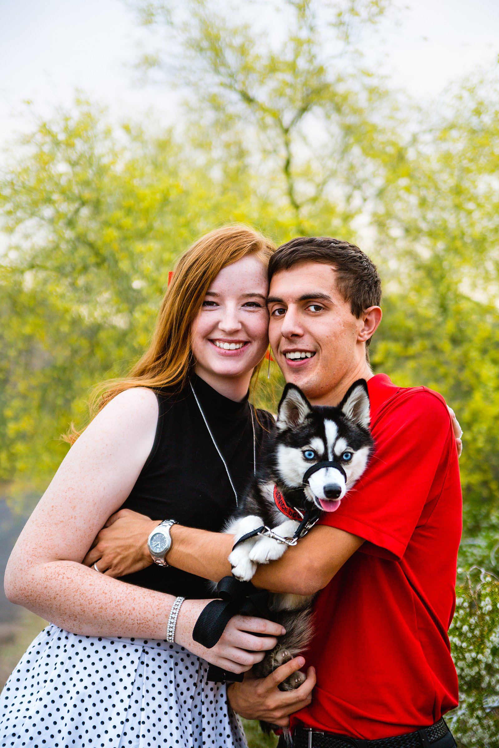 Couple pose with their dog during their Phoenix anniversary session by Arizona wedding photographer PMA Photography.