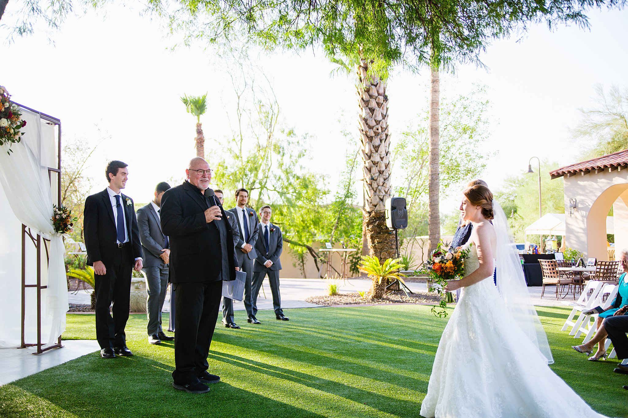 Wedding ceremony at Secret Garden Events by Arizona wedding photographer PMA Photography.