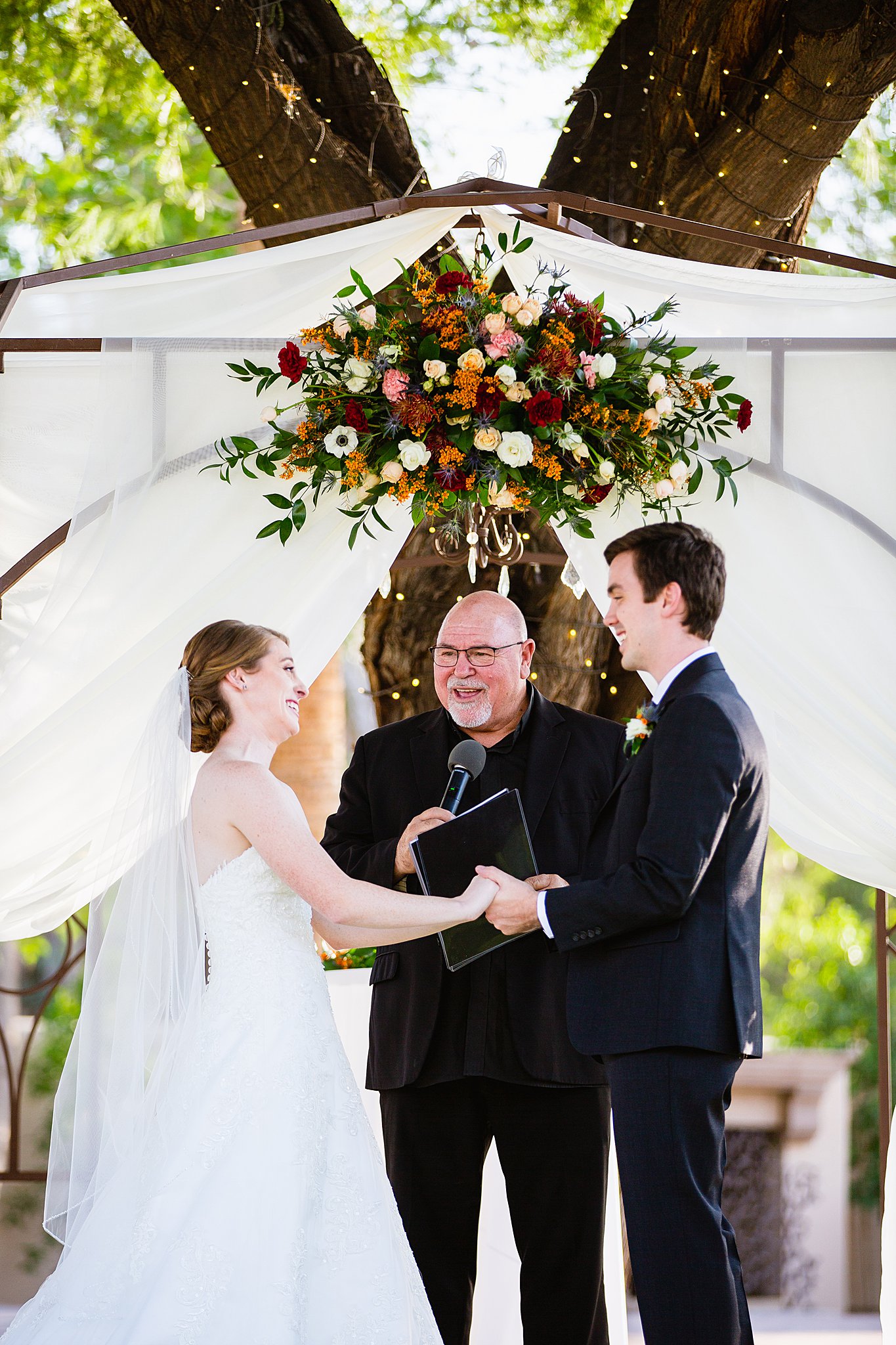 Bride and Groom togethering during Secret Garden Events wedding ceremony by Phoenix wedding photographer PMA Photography.