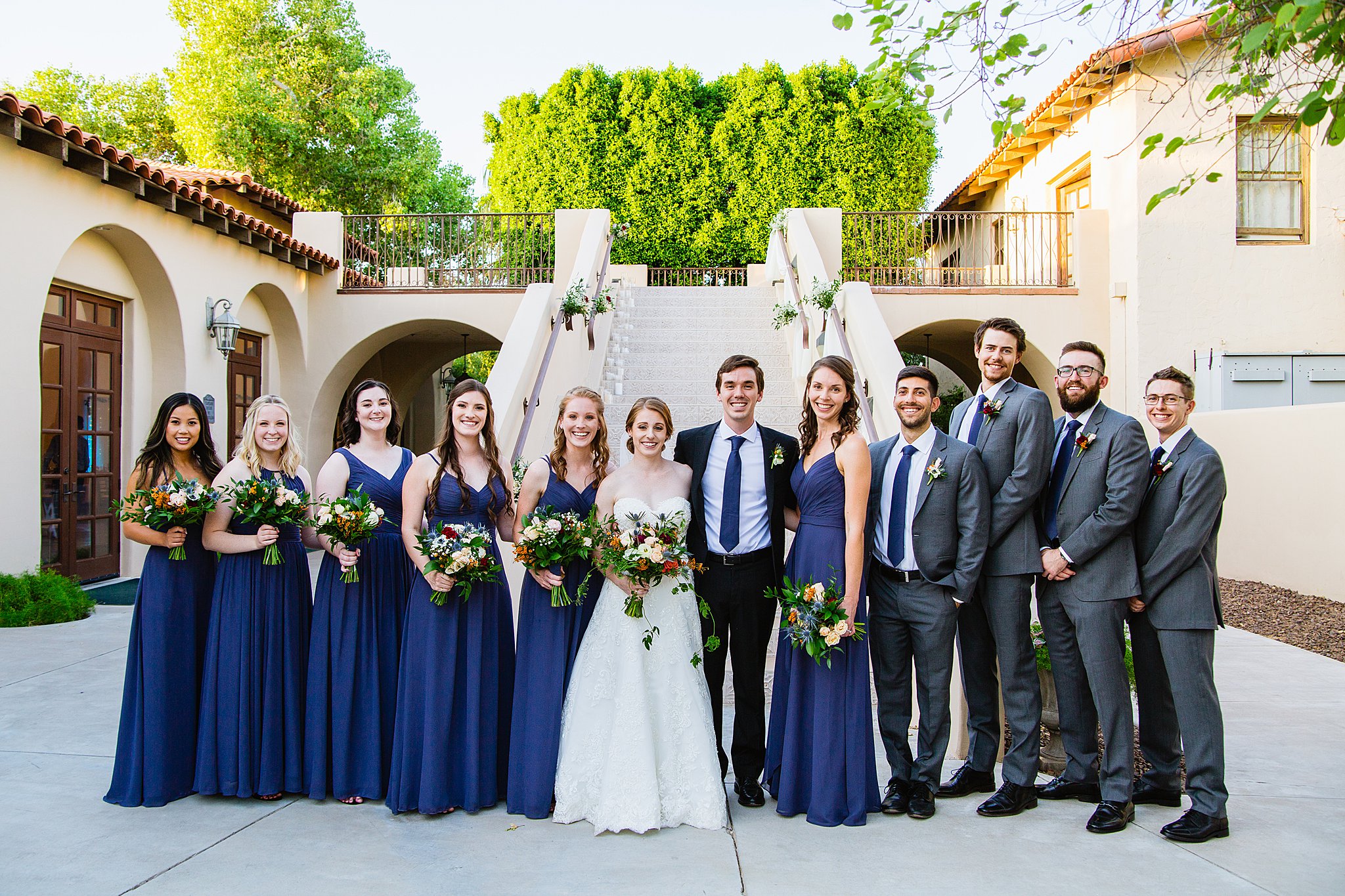 Mixed gender bridal party together at a Secret Garden Events wedding by Arizona wedding photographer PMA Photography.